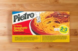 Pietro spaghetti dish packaging with spaghetti and tomato sauce, yellow-red colors.