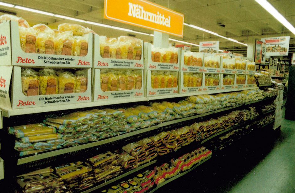 Shelf with various types of Peter brand pasta in a supermarket, part of modern pasta factory production from the mid-1990s onwards